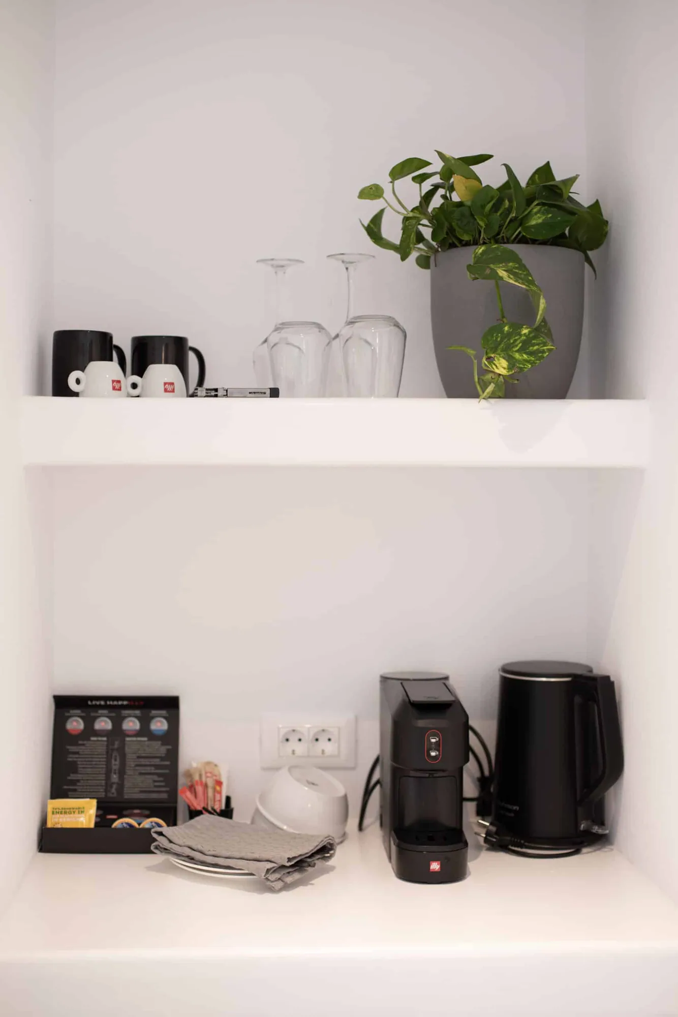 Shelves with cups and espresso machine